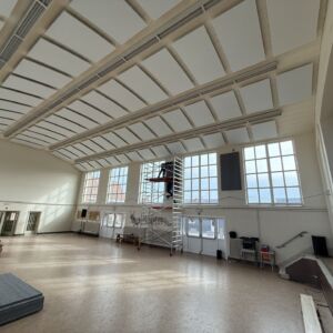 Ceiling soundproofing panels in sports hall for acoustic absorption