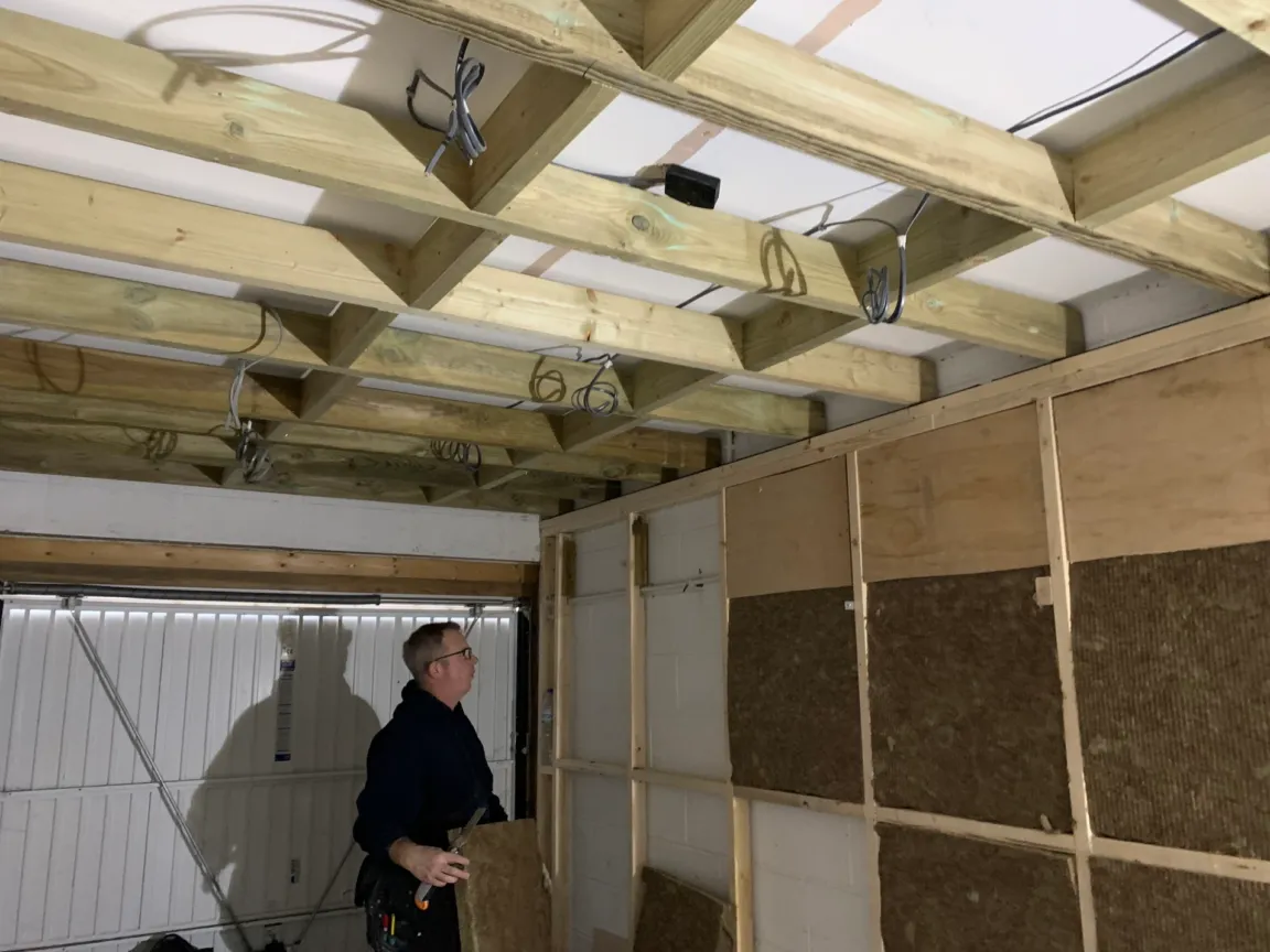Installing wall soundproofing with ceiling prepared for soundproofing too
